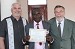 Pastors Tim & Bill with an Uganda graduate